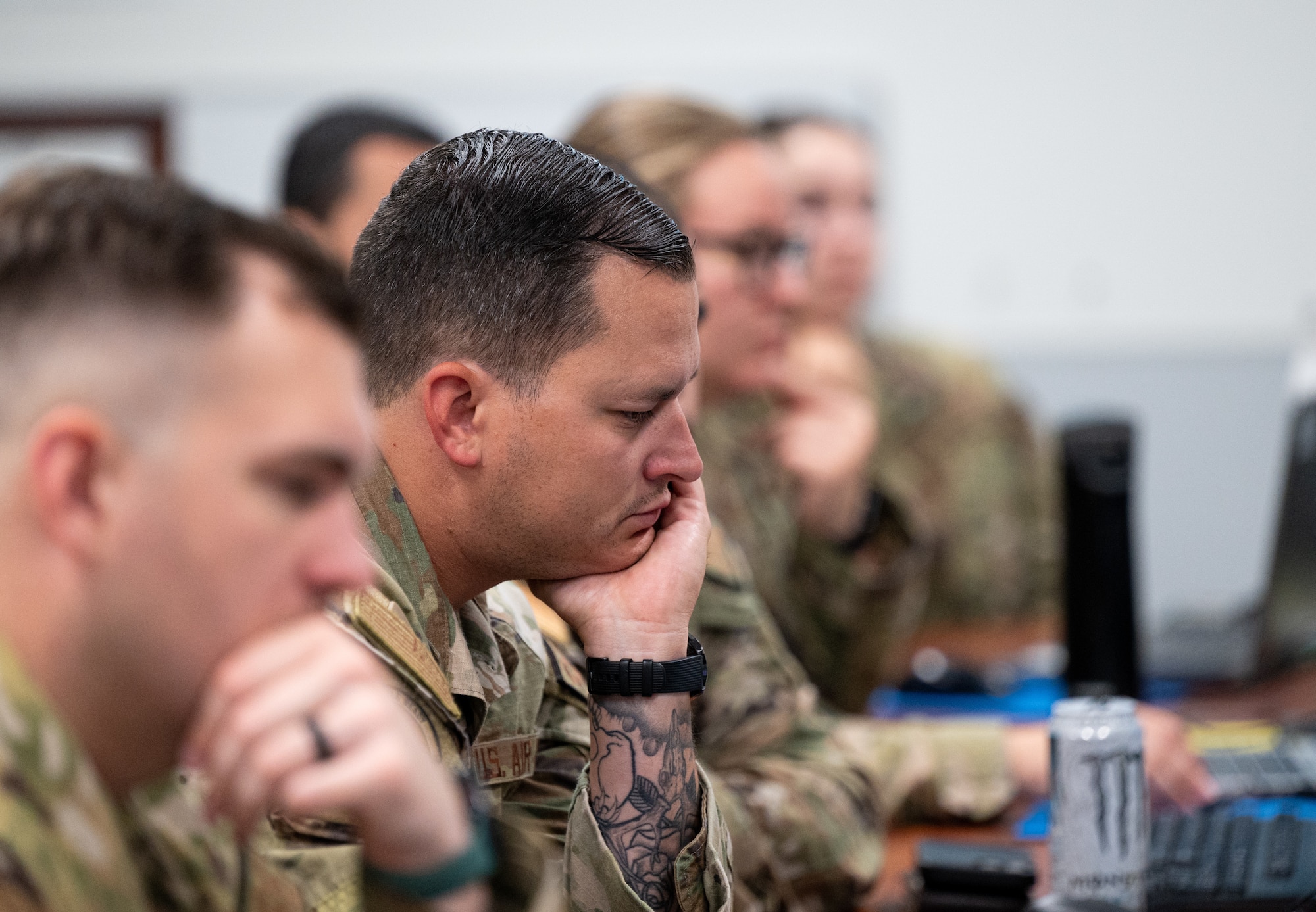 Airmen partake in a hurricane crisis exercise at the Emergency Operations Center.