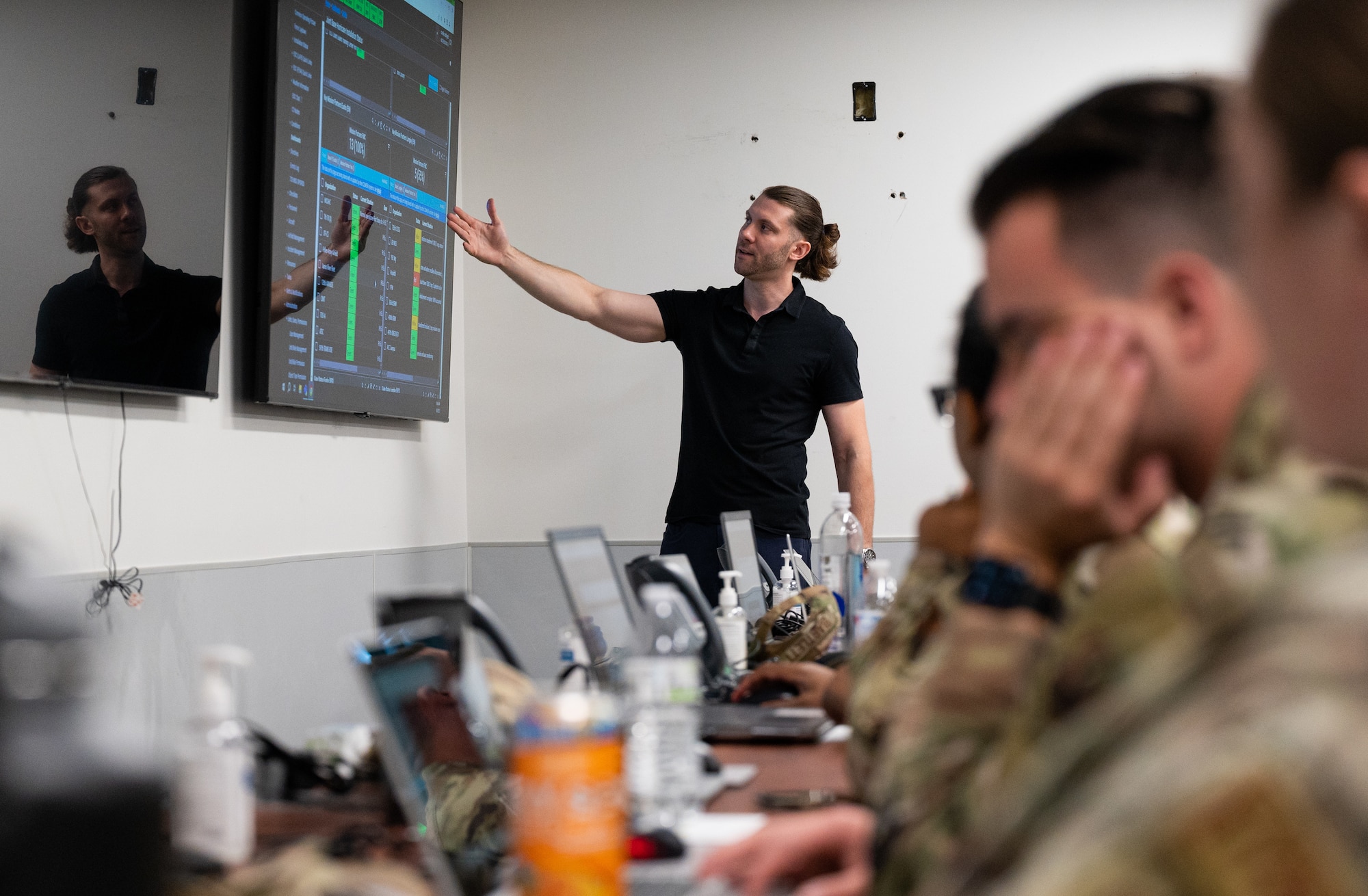 Airmen partake in a hurricane crisis exercise at the Emergency Operations Center.