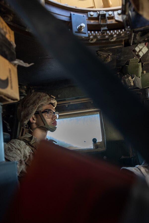 U.S. Marine Corps Pfc. Julien Kleiv, a military police officer assigned to Military Police Company C, 4th Law Enforcement Battalion, Force Headquarters Group, Marine Forces Reserve, rides in a Humvee at Marine Corps Air-Ground Combat Center Twentynine Palms, California, as part of Integrated Training Exercise 4-23, June 14, 2023. As the Marine Corps Reserve’s premier annual training event, ITX provides opportunities to mobilize geographically dispersed forces for a deployment; increase combat readiness and lethality; and exercise MAGTF command and control of battalions and squadrons across the full spectrum of warfare. Kleiv is a native of Hilliard, Ohio and attended Bradley High School. (U.S. Marine Corps Photo by Lance Cpl. Juan Diaz)