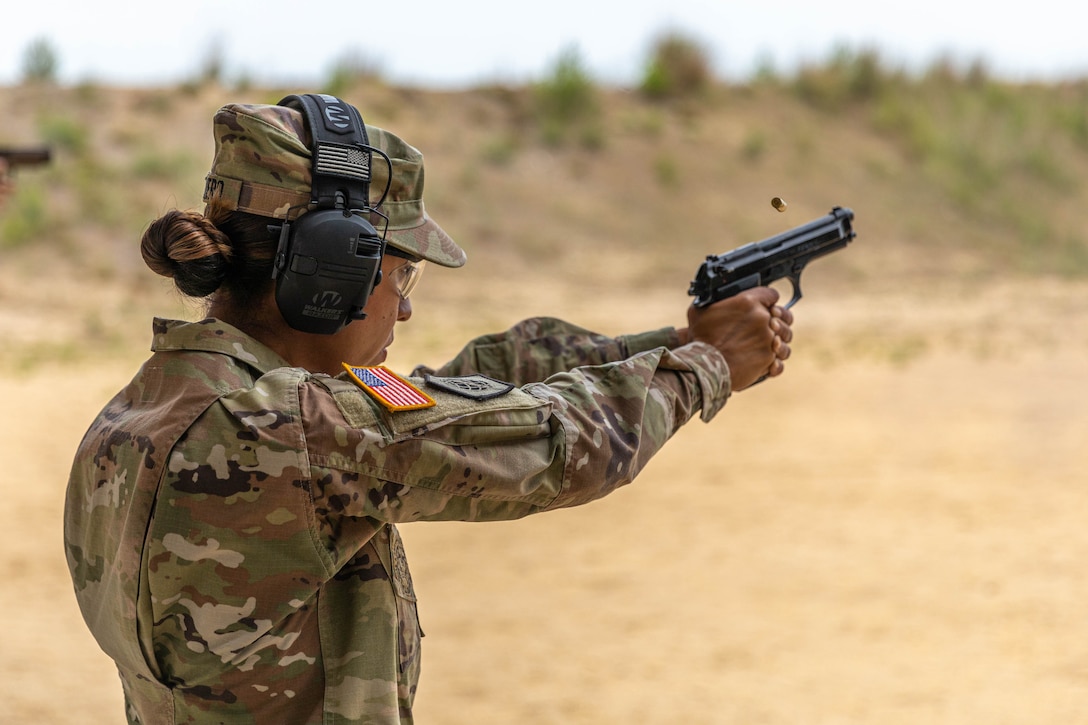Army Reserve 1st Lt. Jessica Romero, 416th Theater Engineer Command fires M9 Beretta