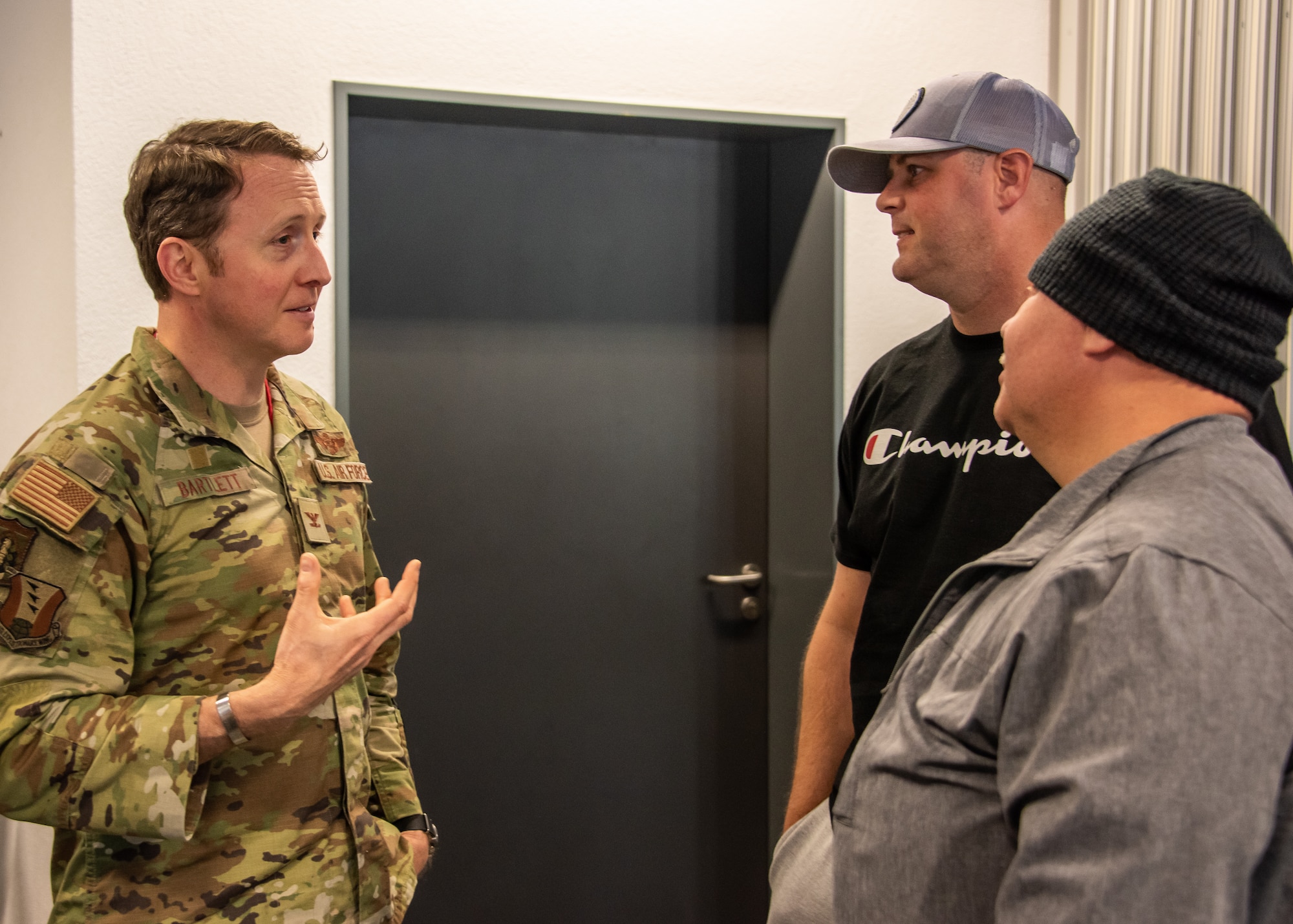 U.S. Air Force Col. Matt Bartlett, 406th Air Ground Operations Wing and 406th Air Expeditionary Wing vice-commander, has a conversation with incoming deployers at Ramstein Air Base, Germany, May 18, 2023.