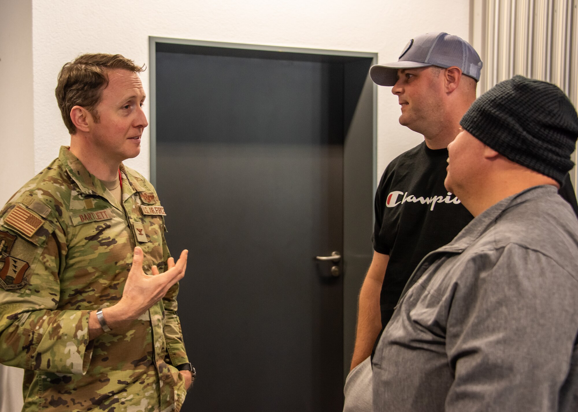 U.S. Air Force Col. Matt Bartlett, 406th Air Ground Operations Wing and 406th Air Expeditionary Wing vice-commander, has a conversation with incoming deployers at Ramstein Air Base, Germany, May 18, 2023.