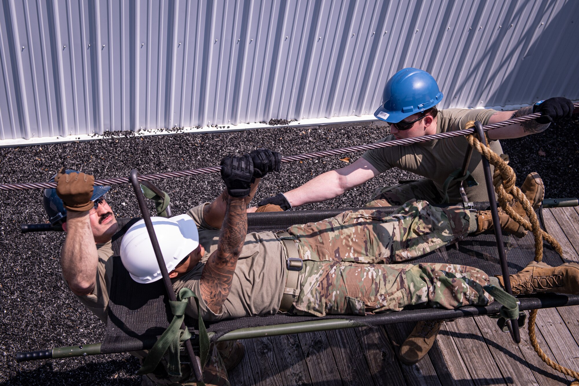 Airmen from the 271st Combat Communications Squadron participate in the leadership reaction course at Fort Indiantown Gap, Pennsylvania, May 21, 2023.
