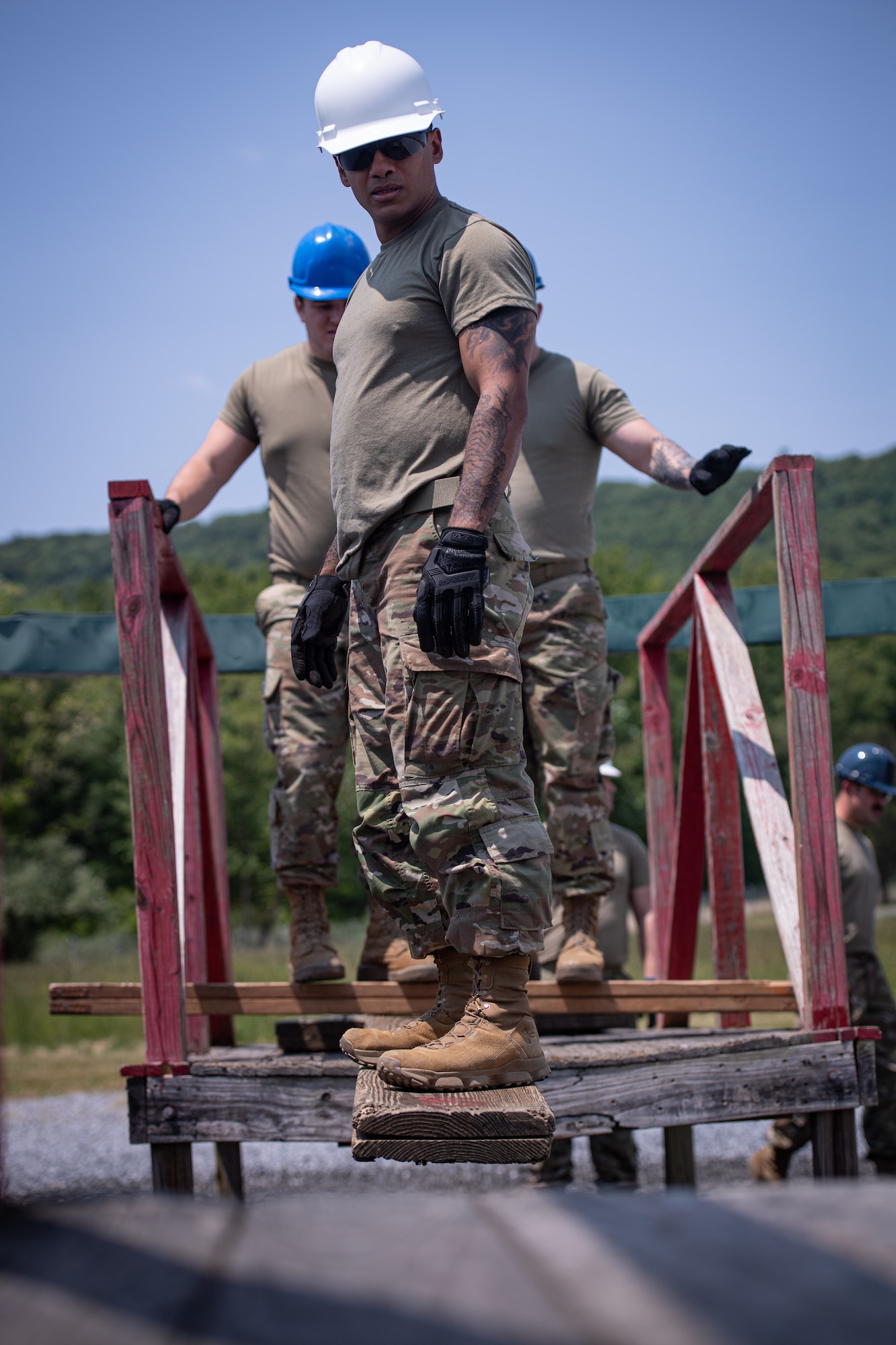 Airmen from the 271st Combat Communications Squadron participate in the leadership reaction course at Fort Indiantown Gap, Pennsylvania, May 21, 2023.