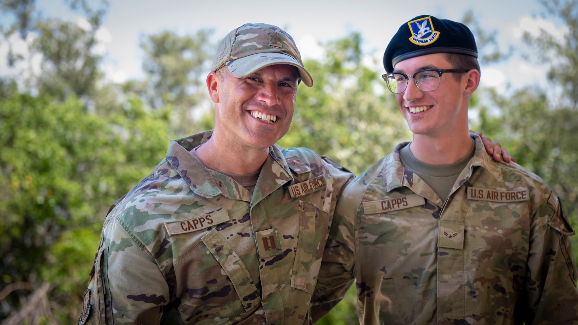 U.S. Air Force Capt. Kory Capps, a chaplain assigned to the 6th Air Refueling Wing, and his son, Airman 1st Class Karter Capps, a defender assigned to the 66th Security Forces Squadron at Hanscom Air Force Base, pose for a photo at MacDill AFB, Florida, June 14, 2023. This father and son duo have an unwavering bond and dedication to the military exemplifying the essence of service, sacrifice, and love. (U.S. Air Force photo by Senior Airman Lauren Cobin)