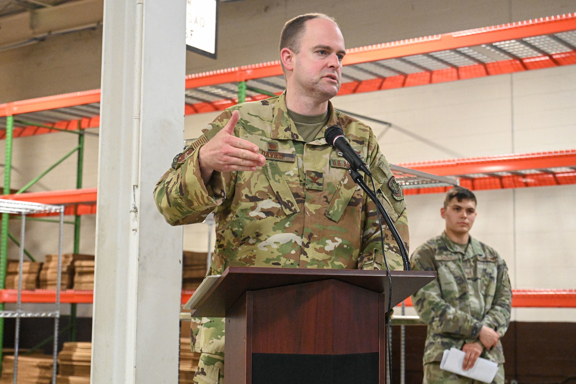 A man in uniform gives a speech.