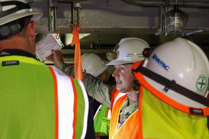 Joint Task Force-Red Hill (JTF-RH) Repair Directorate Project Manager, U.S. Air Force Maj. John Nussbaum, describes a repair to regulators of the Hawaii Department of Health and Environmental Protection Agency during a walkthrough to observe the repairs performed of the Red Hill Bulk Fuel Storage Facility (RHBFSF) in Halawa, Hawaii, Jun. 12, 2023.