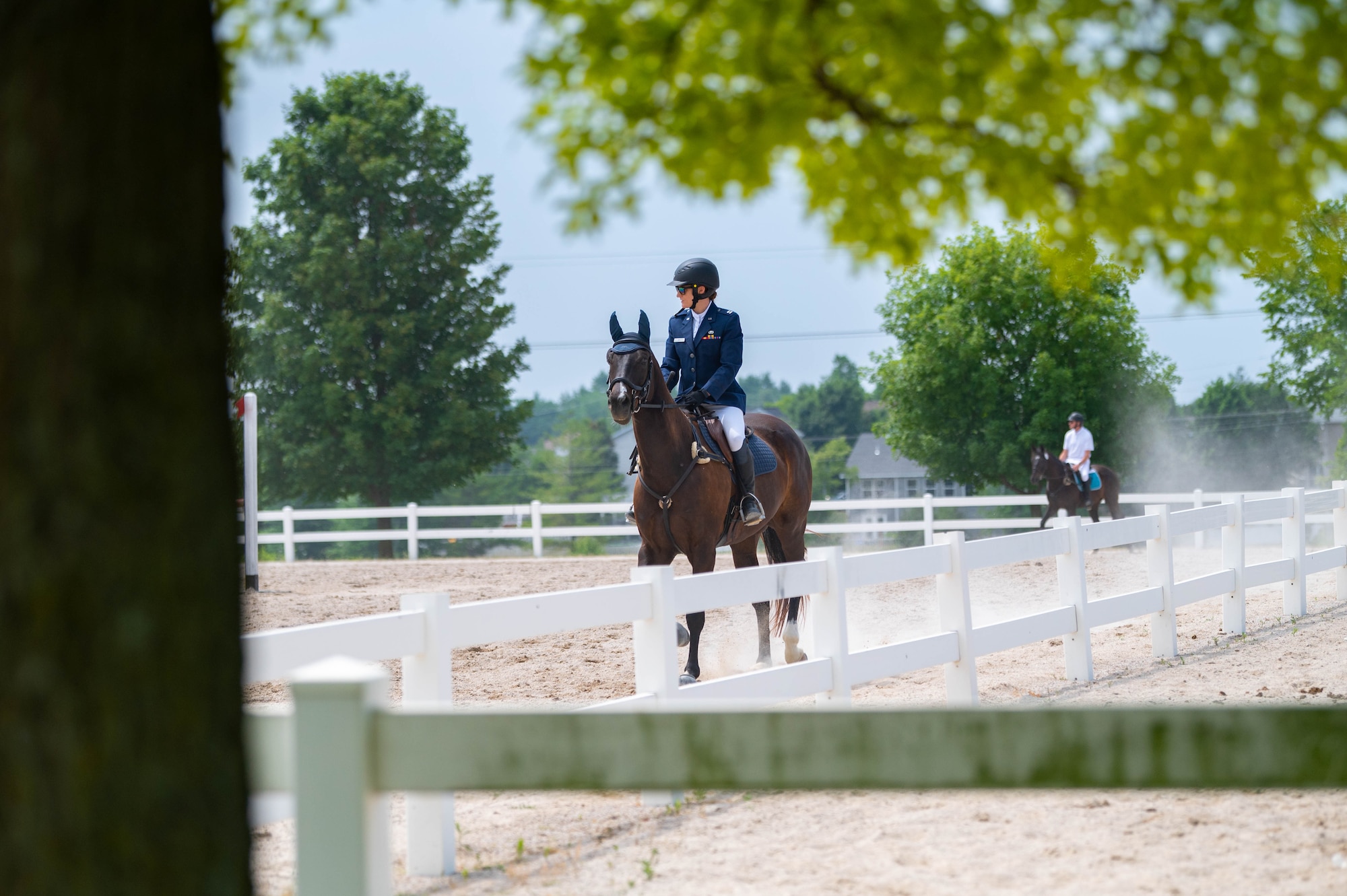 U.S. Air Force Capt. Magin Day, 375th Operational Medicine Readiness Squadron flight commander, rides Rumor, her horse, before competing on the first day of the two-day 2023 Queeny Park Equestrian Events Horse Trials at the National Equestrian Center, St. Louis, Missouri, June 10, 2023. One of the first-day events was dressage, where a horse and rider perform various movements in front of judges. (U.S. Air Force photo by Airman 1st Class De’Quan Simmons)