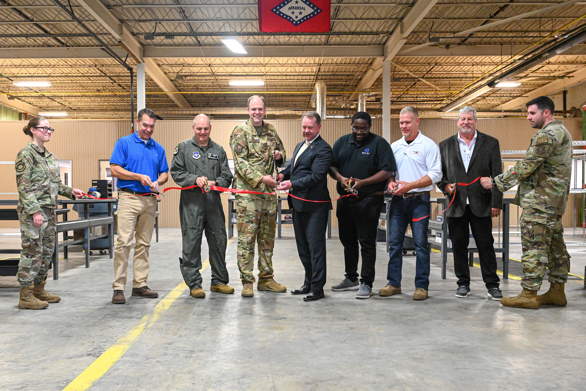 leaders cut a ribbon
