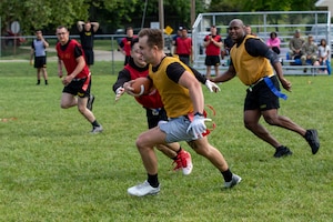 U.S. Army Soldiers assigned to 1st Brigade Engineer Battalion, 2nd Armored Brigade Combat Team, 1st Infantry Division, and Headquarters and Headquarters Battalion, played flag football on Fort Riley, Kansas, June 13, 2023. This game was played during Fort Riley’s Victory Week event. Victory Week promotes a culture of victory by connecting the division’s historic past to the present and includes events and competitions for Soldiers and families of the 1st Infantry Division, Big Red One veterans, and distinguished member of the Flint Hills community. (U.S. Army photo by Pvt. Autumn Johnson)