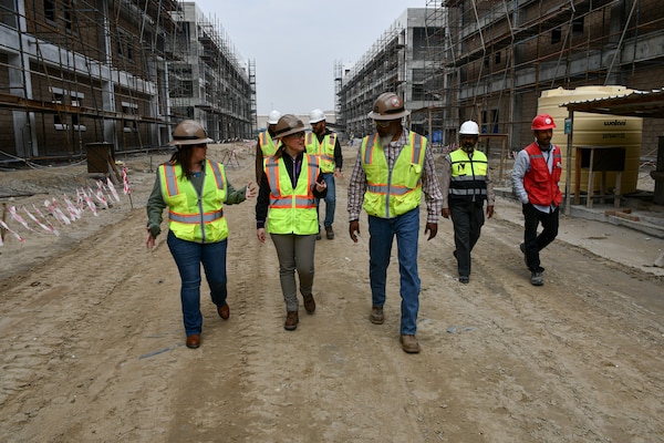 Melanie Barajas, U.S. Army Corps of Engineers Transatlantic Division Safety and Occupational Health chief (center), Kalyn Chism, Transatlantic Expeditionary District Safety and Occupational Health chief (left), and Michael Lowery, Expeditionary District construction control representative (right), walk a project site at Camp Arifjan, Kuwait, on Jan. 26.