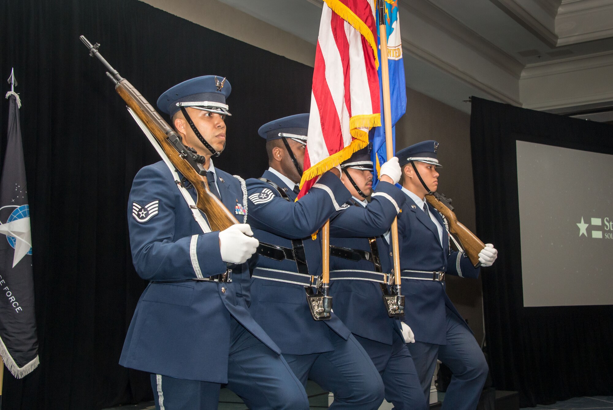 The Los Angeles Air Force Base Honor Guard presents the colors during opening ceremonies for the 2023 Salute to Space Systems Command awards banquet in Los Angeles, California, June 9, 2023. The banquet, hosted by the Air and Space Forces Association Los Angeles Chapter 147, recognizes members within SSC who excel in leadership, technical performance, volunteerism, and innovation. This year, SSC honored 16 personnel – civilian and military – whose skillsets reflect various areas of Science, Technology, Engineering, and Mathematics. (U.S. Space Force photo by Van Ha)