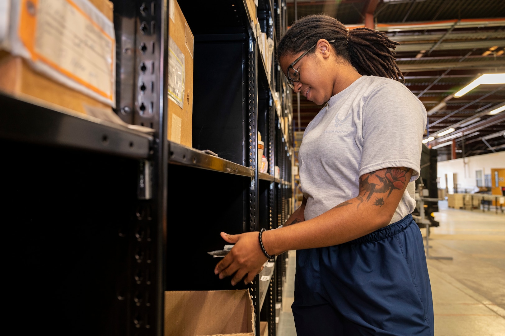 U.S. Air Force Senior Airman Joinell Reid, 49th Logistics Readiness Squadron central warehouse technician, checks for an item at Holloman Air Force Base, New Mexico, June 12, 2023.