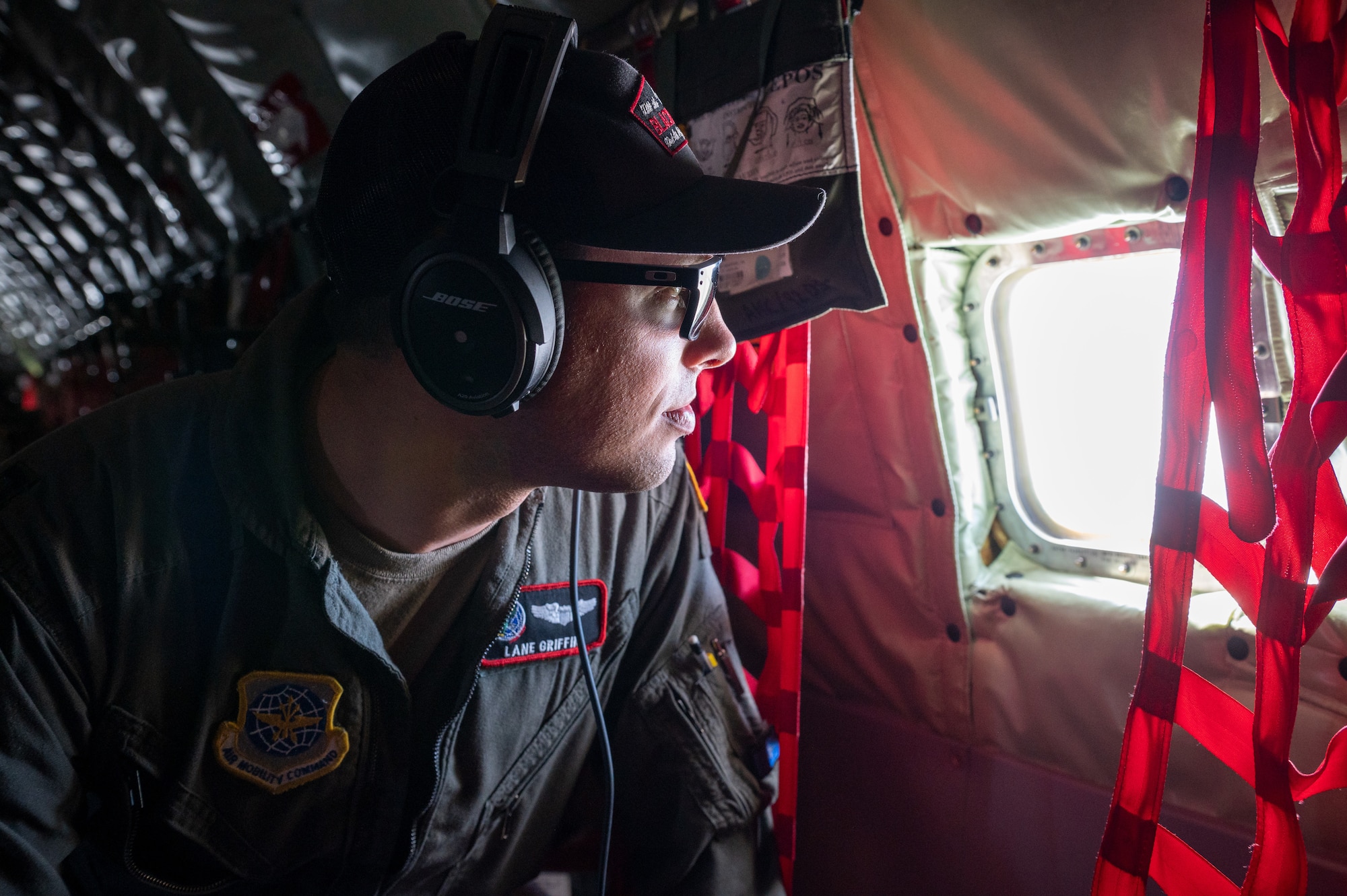U.S. Air Force Capt Lane Griffin, 92nd Air Refueling Squadron pilot, looks out the window of a KC-135 Stratotanker during a Phase 3 Lead Wing exercise, June 6th, 2023. The exercise emphasized aircrew endurance while crew resting on the aircraft, wearing devices that track real time fatigue/stress on the aircrew, dynamic air refueling concepts, testing of a variety of the KC-135 mission sets, and included an advanced 72-hour endurance event.