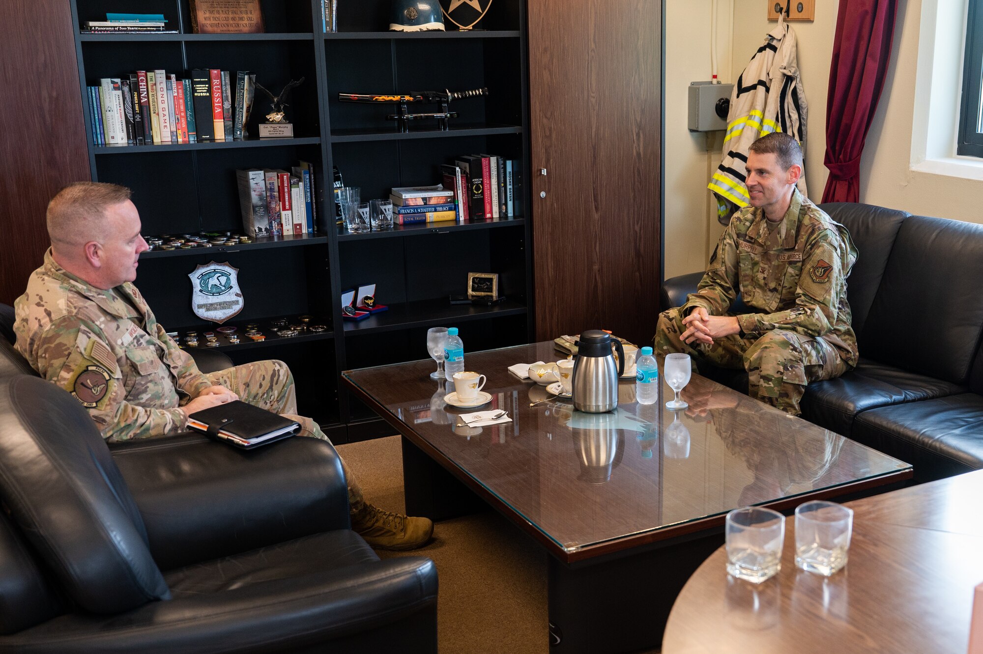 Col. Timothy B. Murphy and Chief Master Sgt. David Wolfe sit for a meeting at Kunsan Air Base