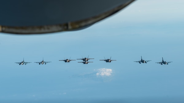 Four Japan Air Self-Defense Force F-2B's fly alongside four U.S. Marine Corps F-35 Lightning II's over the Japan Sea, June 16, 2023.