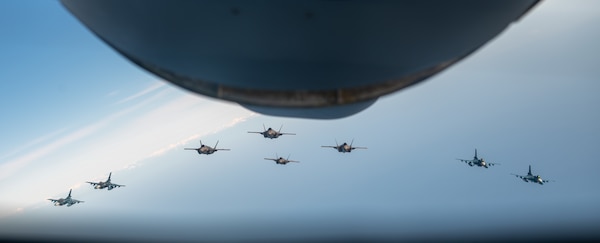 Four Japan Air Self-Defense Force F-2B's fly alongside four U.S. Marine Corps F-35 Lightning II's over the Japan Sea, June 16, 2023.