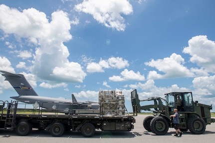 U.S. Airmen from the 114th Electromagnetic Warfare Squadron, Florida Air National Guard, load pallets of cargo onto a C-17 Globemaster III in preparation for exercise ThunderMoose at Bangor Air National Guard Base, Maine, June 11-21, 2023. The multistate mobility and weapon system training event will task five Air National Guard units to establish a forward operating area, fine tune electromagnetic attack capabilities and prepare for an upgrade to a more agile counter communications system.