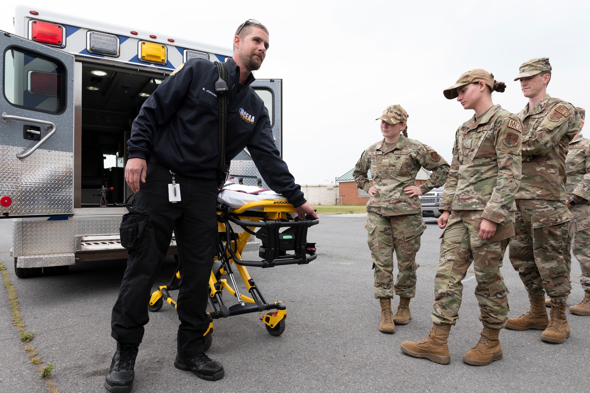 Bruce Johahn, and EMT with the Berkeley County Emergency Medical Services, provides stretcher and ambulance familiarization training to 167th Medical Group Airmen as part of of an extended unit training assembly at Shepherd Field, Martinsburg, West Virginia, June 9, 2023