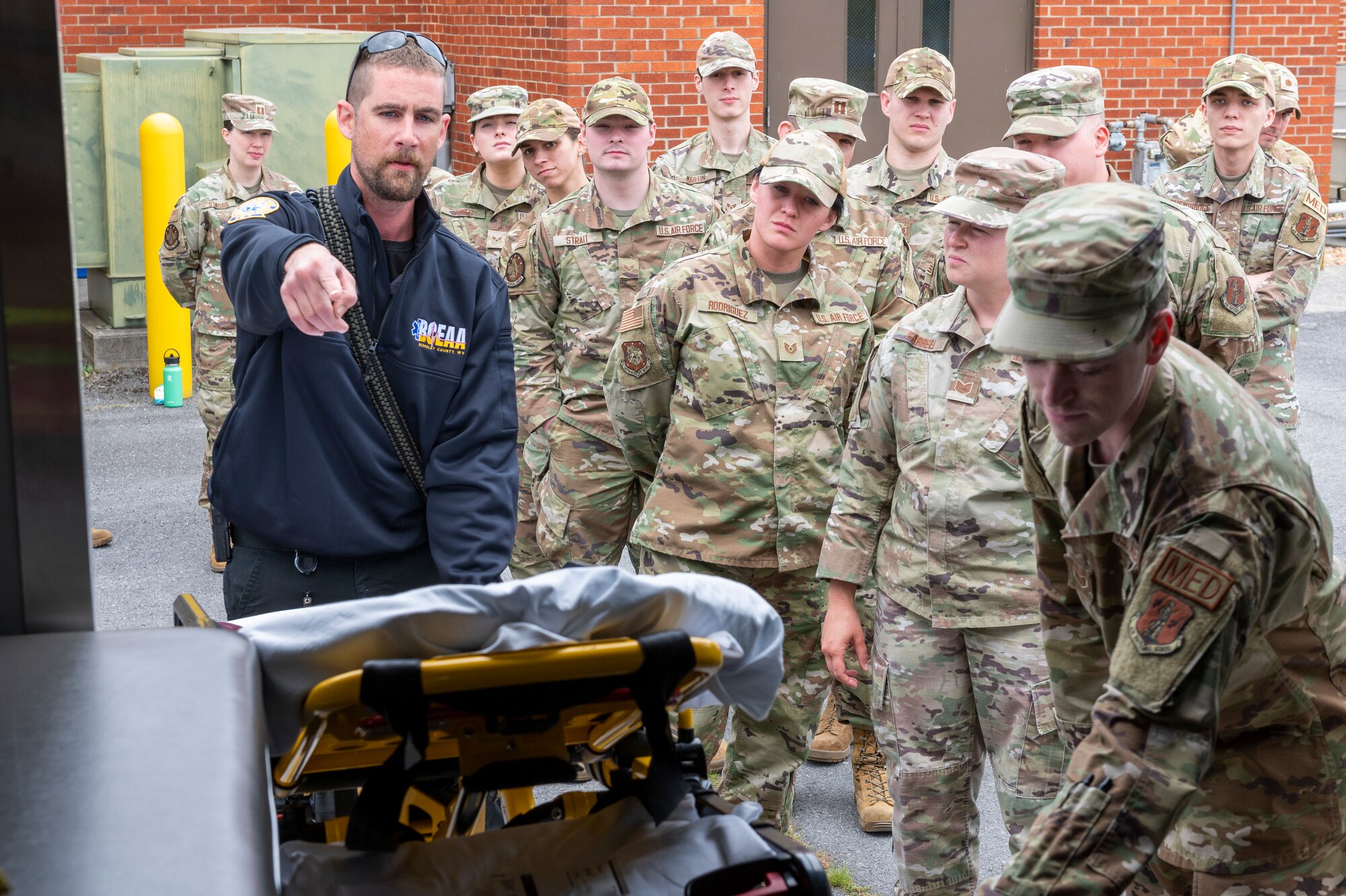 Bruce Johahn, and EMT with the Berkeley County Emergency Medical Services, provides stretcher and ambulance familiarization training to 167th Medical Group Airmen as part of of an extended unit training assembly at Shepherd Field, Martinsburg, West Virginia, June 9, 2023.