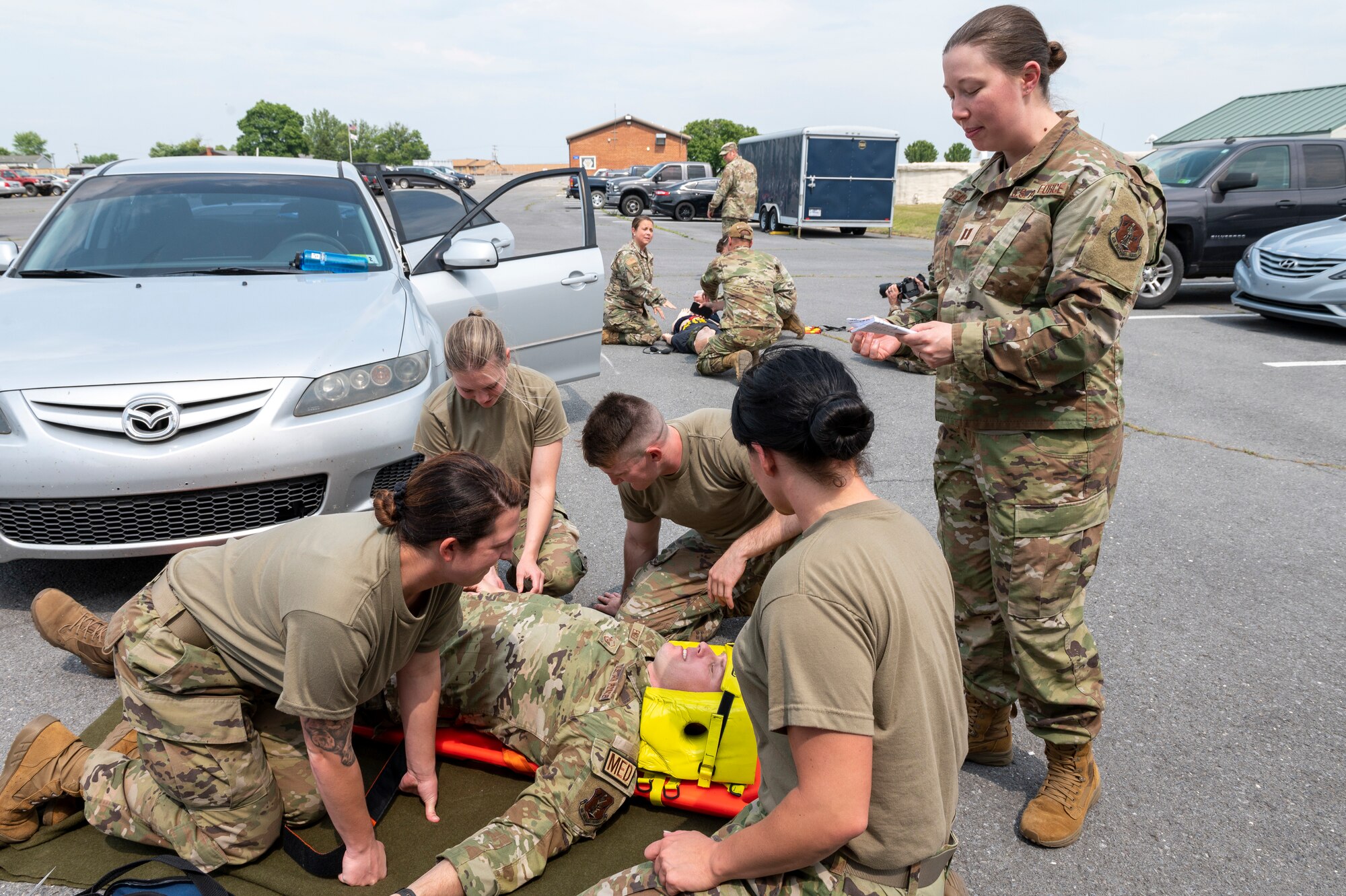 Capt. Hanna Staubs, 167th Medical Group, right, provides instruction to medical services Airmen during a casualty exercise as part of an extended unit training assembly at Shepherd Field, Martinsburg, West Virginia, June 9, 2023.