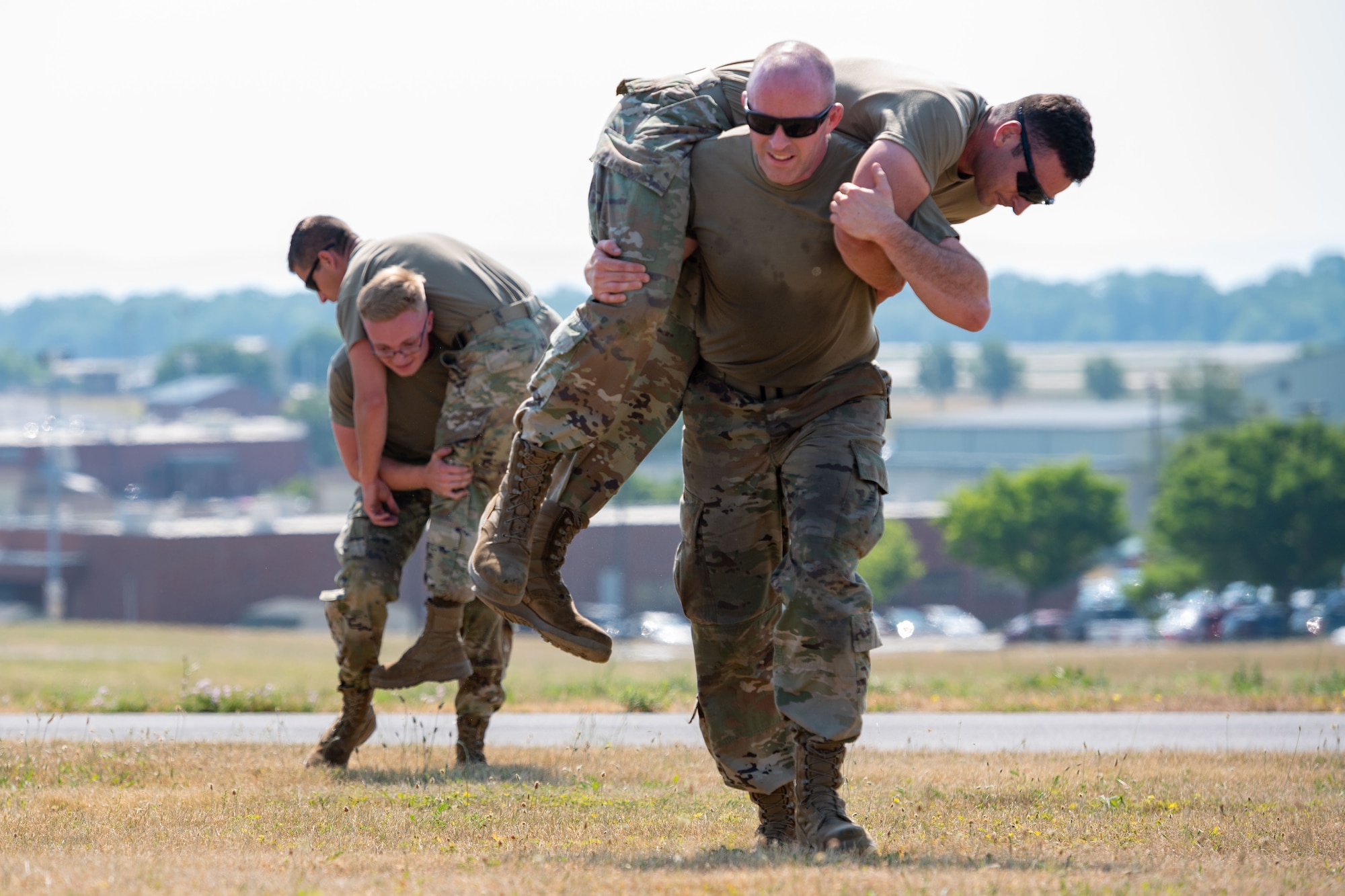 A group of Airmen with the 167th Airlift Wing perform a fireman’s carry at Shepherd Field, Martinsburg, West Virginia, June 10, 2023.