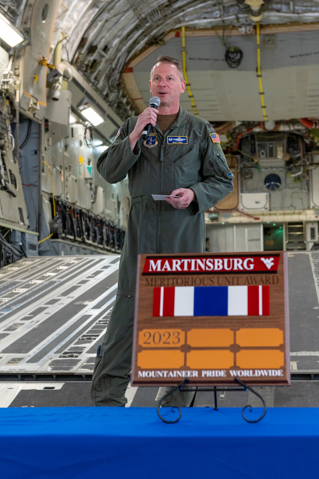 U.S. Air Force Col. Martin Timko, 167th Airlift Wing commander, addresses the wing during a commander’s call to conclude the official business of the unit’s training assembly, June 11, 2023.