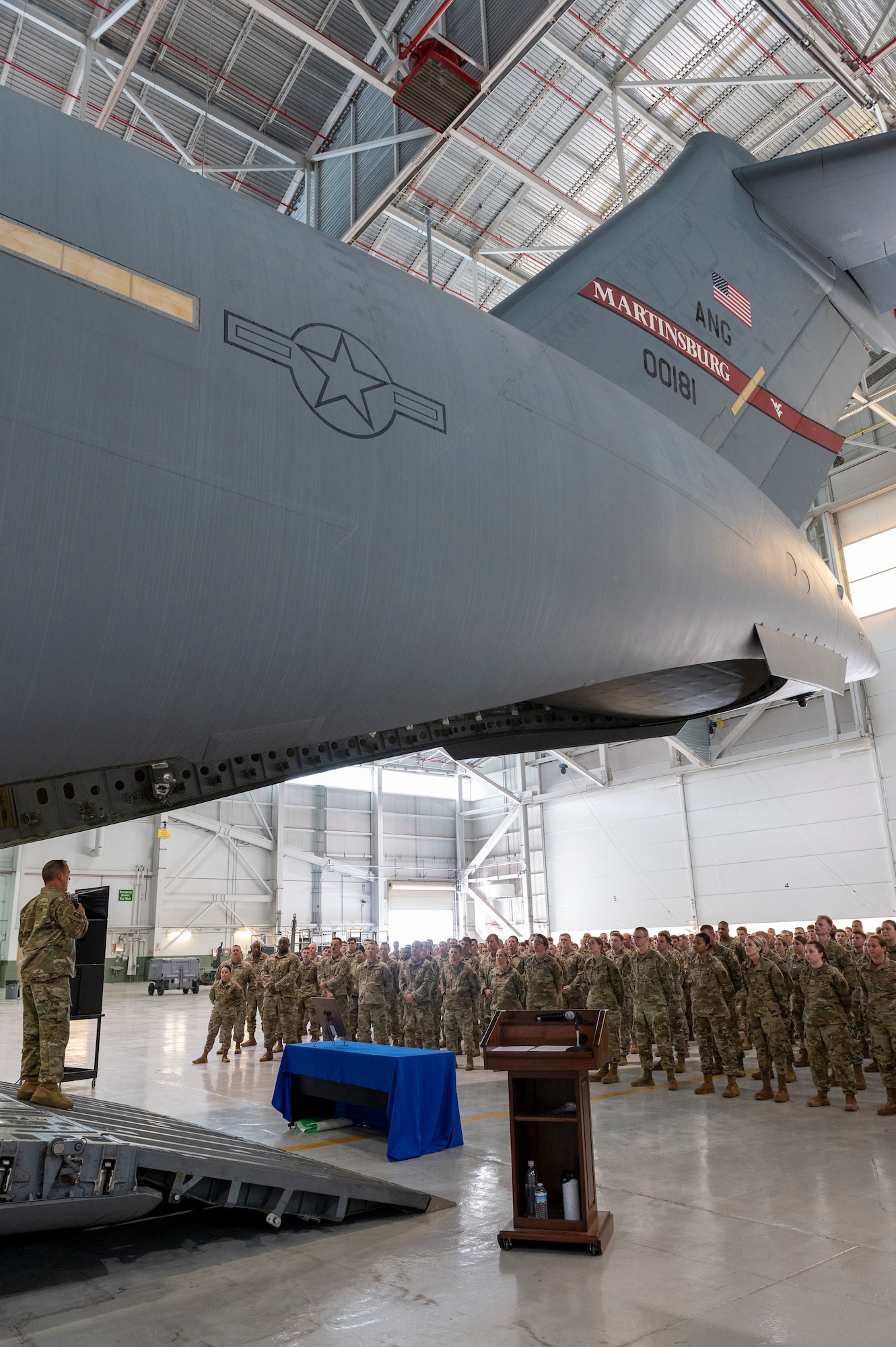167th Airlift Wing Command Chief Master Sgt. Troy Brawner addresses the wing during a commander’s call in a hangar at Shepherd Field, Martinsburg, West Virginia, June 11, 2023. The commander’s call was the last official requirement for the month’s four-day training assembly.