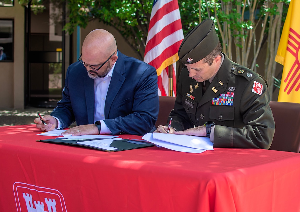 Lt. Col. Jerre Hansbrough (right), commander, USACE-Albuquerque District, and Jason Casuga, chief engineer and CEO of the MRGCD, sign a design agreement for the Middle Rio Grande, Bernalillo to Belen, flood control project, June 13, 2023.