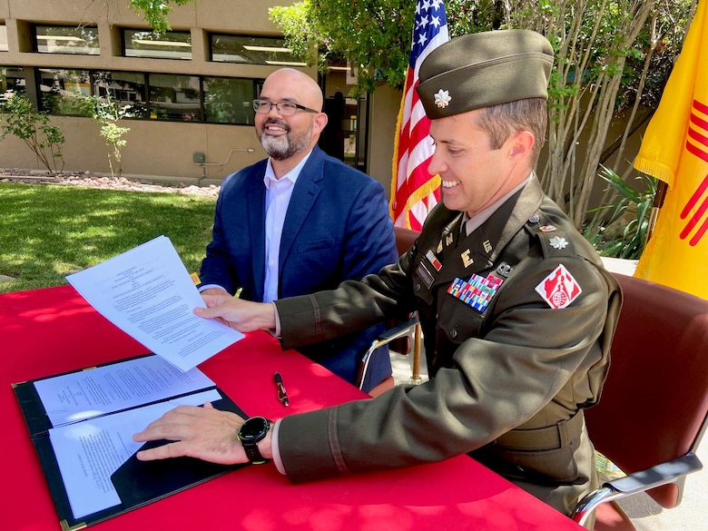 Lt. Col. Jerre Hansbrough (right), commander, USACE-Albuquerque District, and Jason Casuga, chief engineer and CEO of the MRGCD sign a design agreement for the Middle Rio Grande, Bernalillo to Belen, flood control project, June 13, 2023.