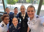 Service members pose for a photo during the 33rd annual Joint Women’s Leadership Symposium in Norfolk, Va., July 12, 2022. Event attendees discussed topics including diversity, inclusion, equity and the importance of intentionality when implementing those concepts. (Courtesy photo)