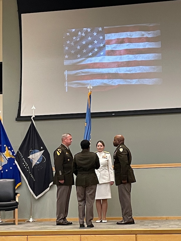 Outgoing DLA Troop Support Commander Army Brig. Gen. Eric Shirley, right, DLA Commander Navy Vice Adm. Michelle Skubic, back, DLA senior enlisted leader Army Sgt. Maj. Tomeka O’Neal, front, prepare to pass the unit colors to the incoming DLA Troop Support Commander Army Col. Landis Maddox signifying the changing of command during a ceremony July 15 in Philadelphia.