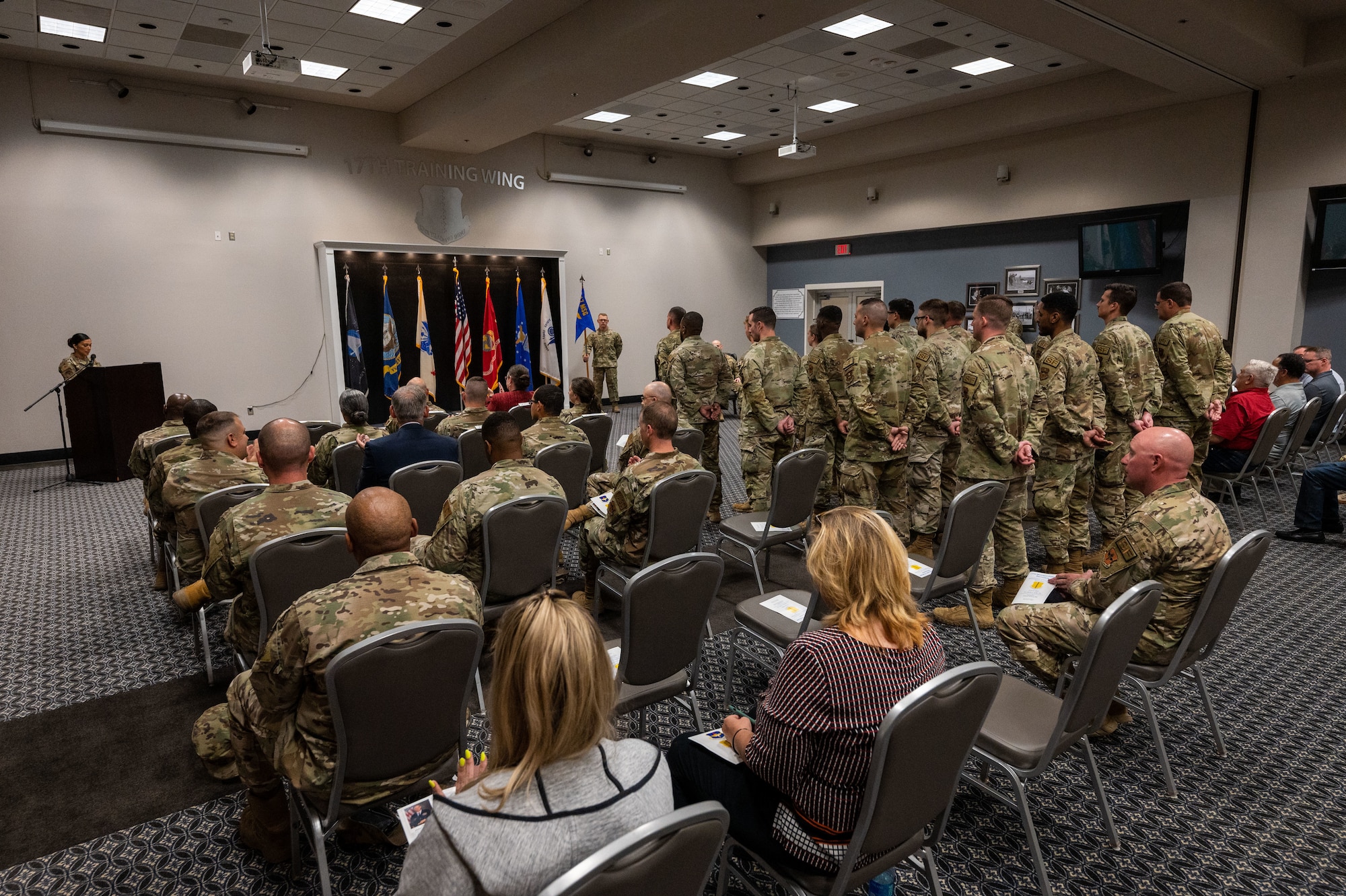 Members from the 17th Training Wing gather for the 17th Security Forces Squadron, assumption of command ceremony at the Powell Event Center, Goodfellow Air Force Base, Texas, June 15, 2023. The change of command ceremony is a military tradition representing the transfer of responsibilities from the outgoing commander to the incoming commander. (U.S. Air Force photo by Staff Sgt. Jermaine Ayers)
