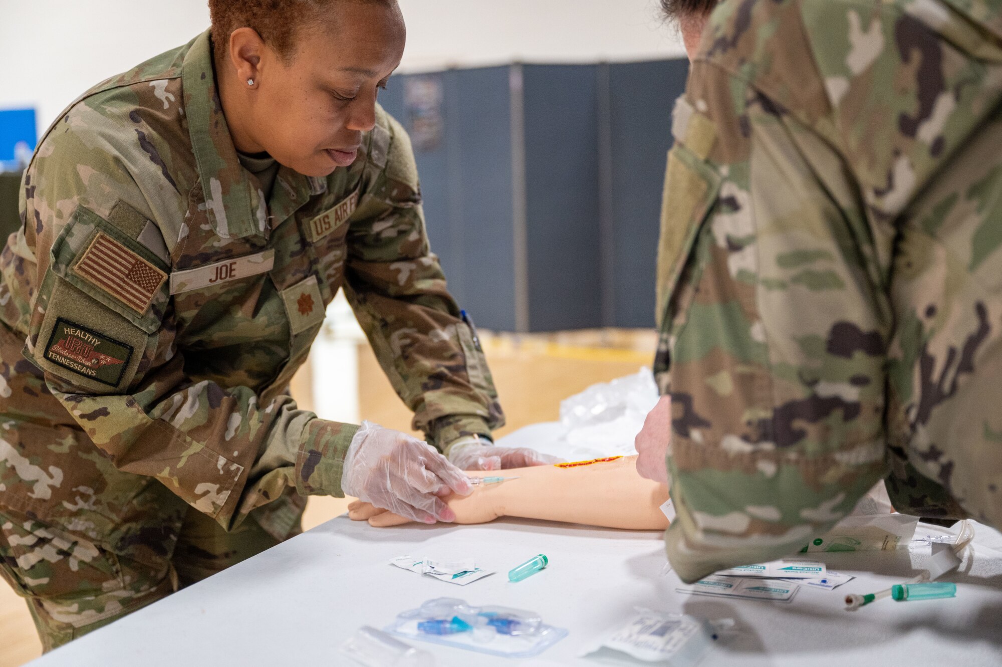 Maj Joe sticks a fake arm with an intravenous needle