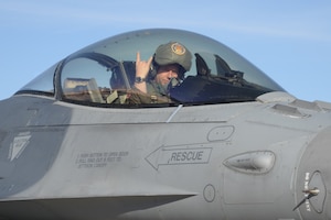 A photo of Lt. Col. Daniel O’Neal, 306th Fighter Squadron commander, landing an F-16C Fighting Falcon fighter jet while participating in the Red Flag-Nellis 23-2 training exercise.