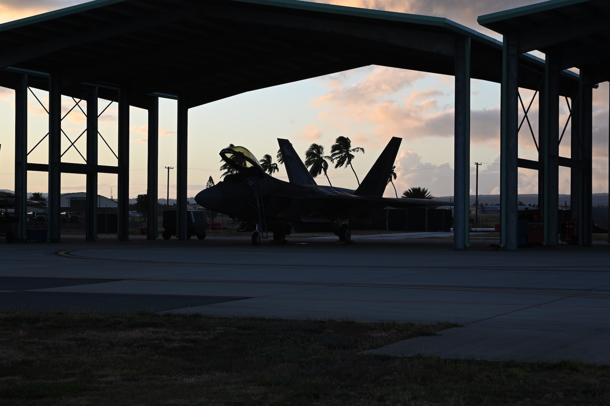 A Total Force F-22 Raptor awaits a preflight check before night operations