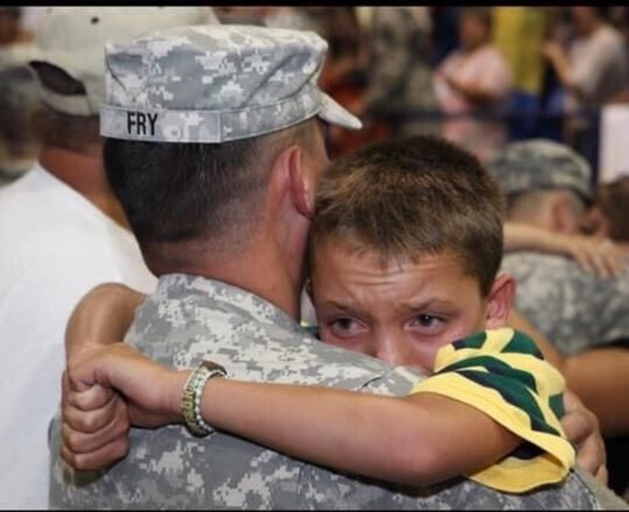 Branden Fry, 97th Aircraft Maintenance Squadron hydraulics systems mechanic, hugs his son, Bryson, during a welcome ceremony in Lawton, Oklahoma, in August 2009. Fry served in the Army National Guard for 20 years and went on five deployments. (Courtesy photo by Branden Fry)