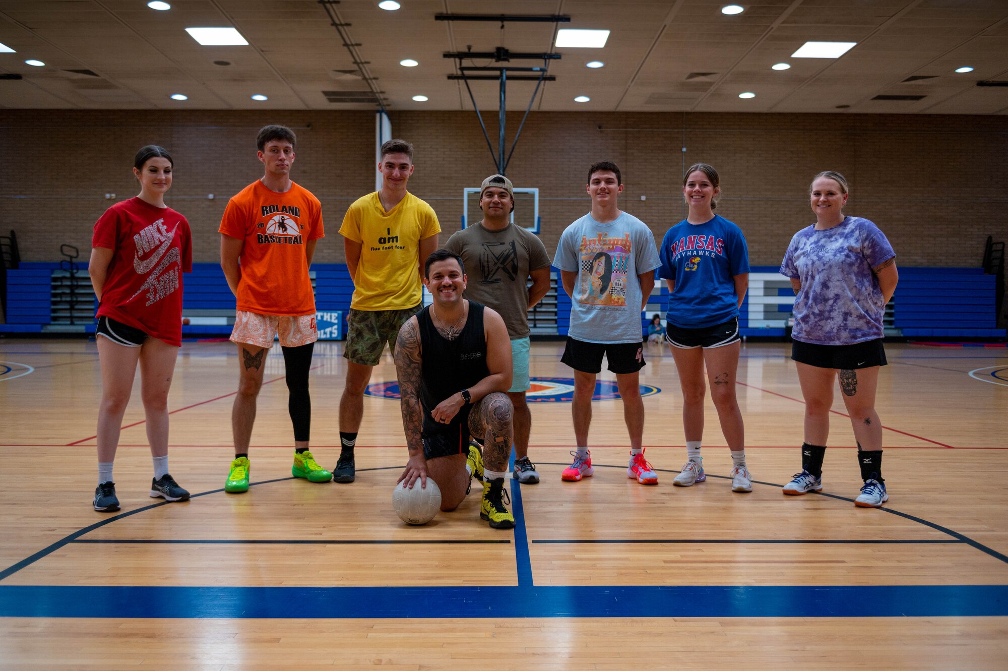 U.S. Air Force Airmen assigned to the 607th Air Control Squadron pose for a photo during a Pride Month volleyball and basketball tournament held by the Luke Pride Committee, June 15, 2023, at Luke Air Force Base, Arizona.