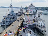 Ships participating in exercise Baltic Operations 2023 (BALTOPS 23) moor in Kiel, Germany, June 16, 2023. BALTOPS 23 is the premier maritime-focused exercise in the Baltic Region. The exercise, led by U.S. Naval Forces Europe-Africa and executed by Naval Striking and Support Forces NATO provides a unique training opportunity to strengthen the combined response capability critical to preserving the freedom of navigation and security in the Baltic Sea. (Courtesy Photo)