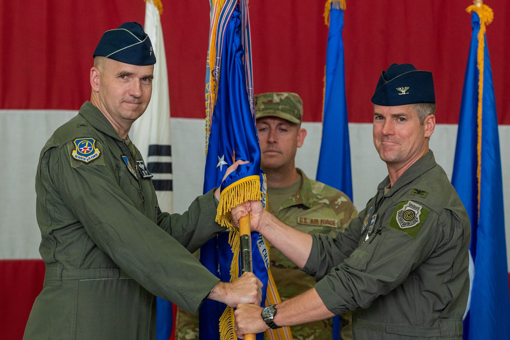 Photos of various leadership, Airmen at a wing-level change of command ceremony