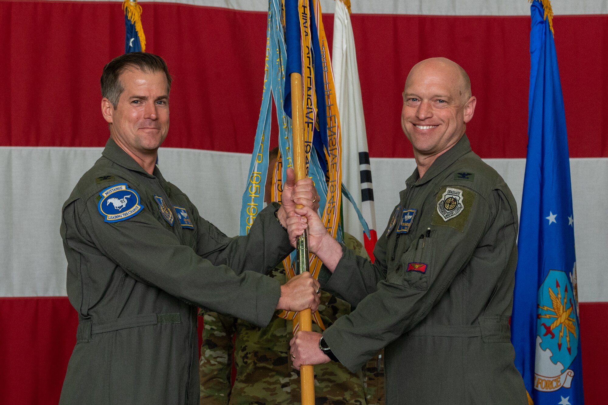 Photos of various Airmen and leadership at a change of command ceremony
