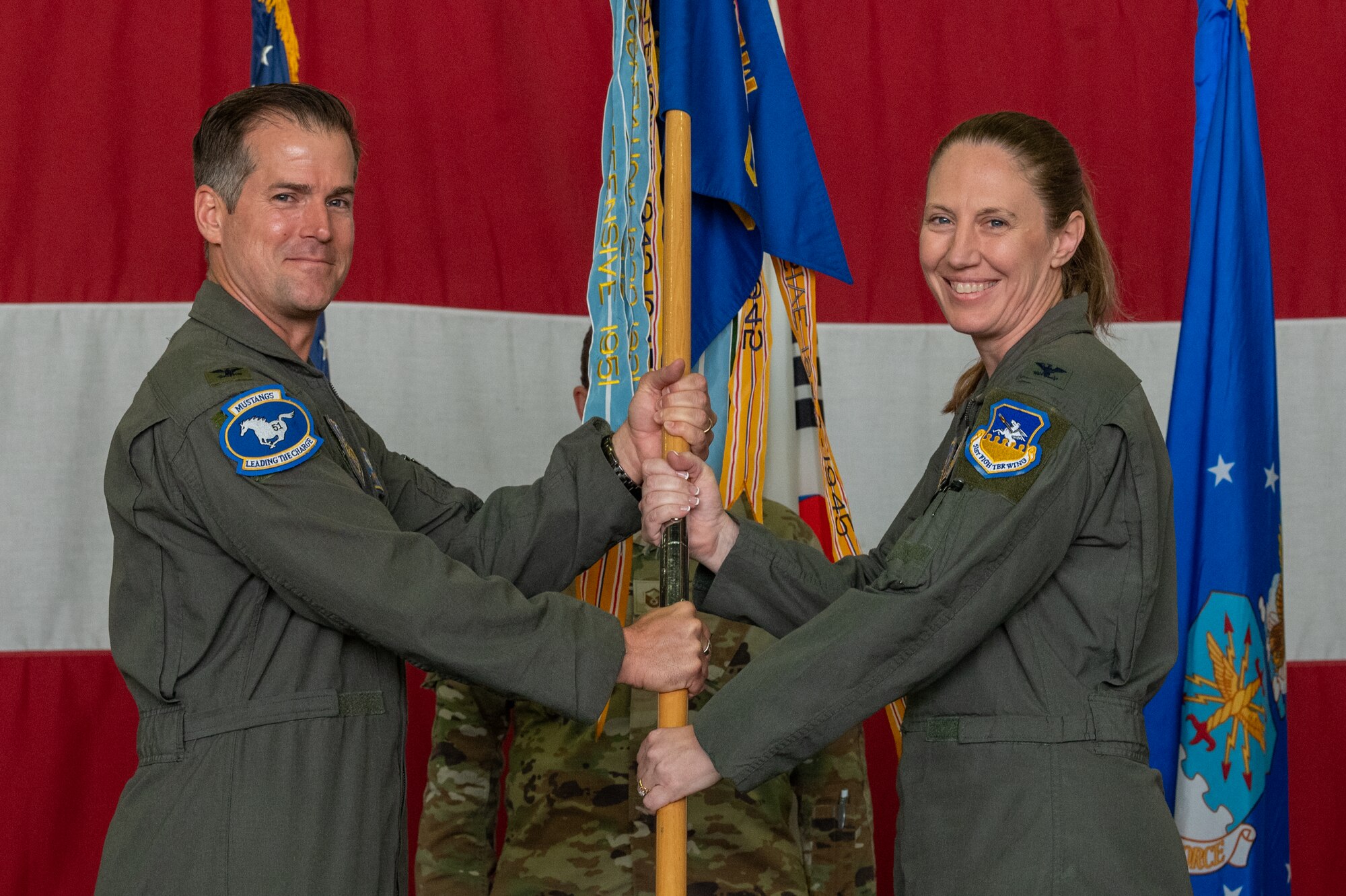 Photos of various Airmen and leadership at a change of command ceremony