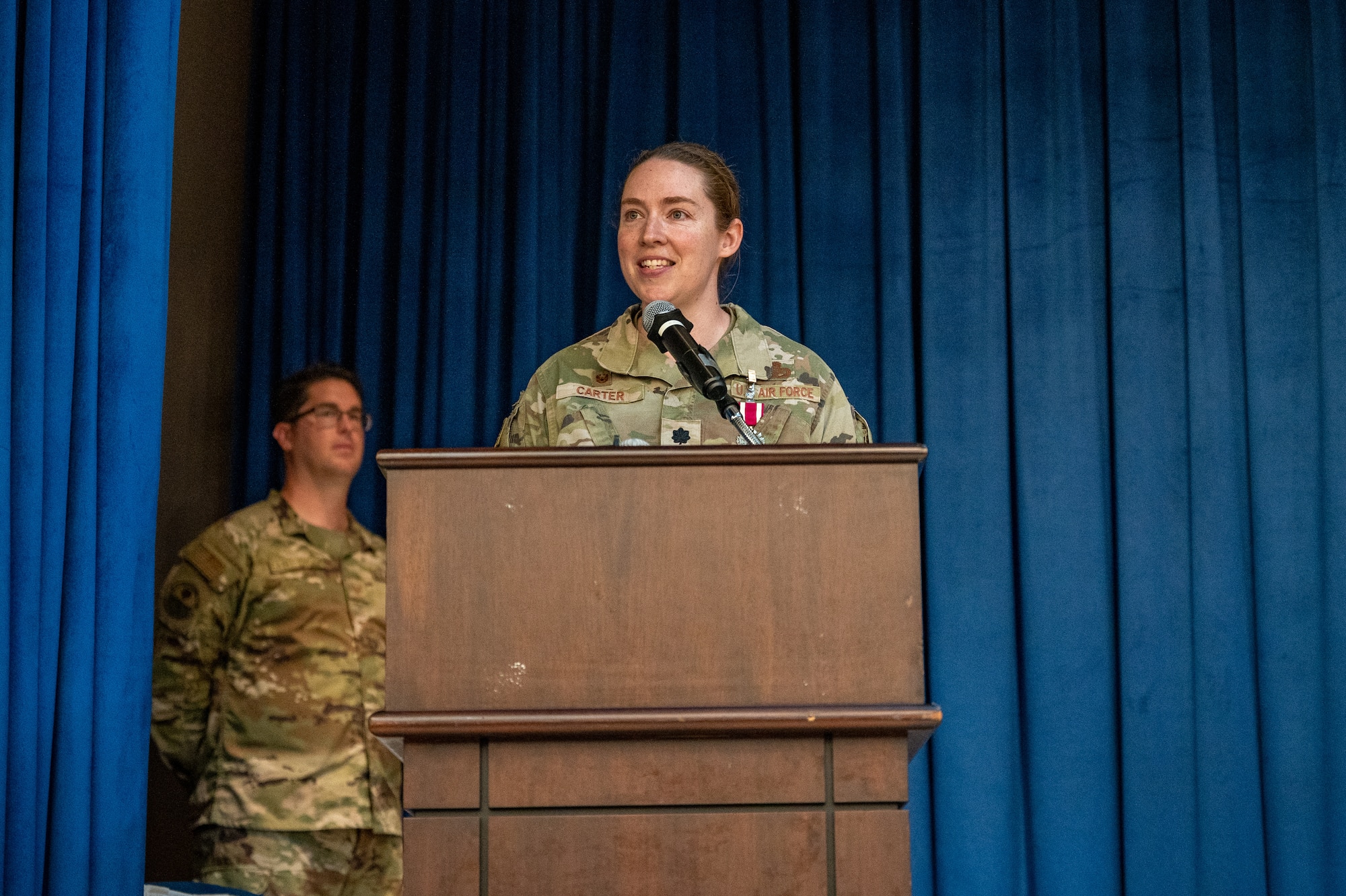 U.S. Air Force Lt. Col. Laura Carter, 6th Intelligence Squadron outgoing commander, provides a final speech to her squadron during the 6th IS change of command ceremony at Osan Air Base, Republic of Korea, June 14, 2023. Lt. Col. Adam Fossum took command of the 6th IS during the ceremony. (U.S. Air Force photo by Senior Airman Thomas Sjoberg)