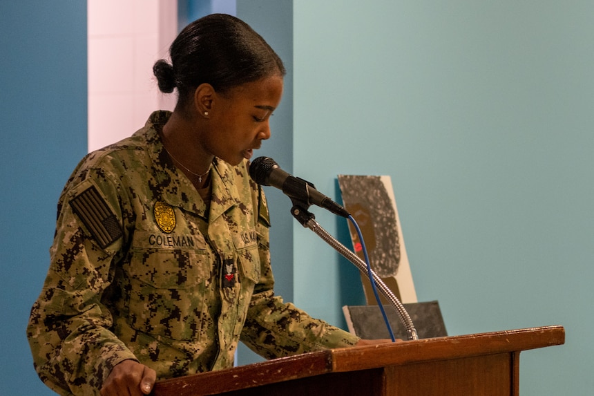 Master-at-Arms 2nd Class Jayla Coleman, assigned to Naval Support Activity (NSA) Souda Bay, speaks about the personal significance of Juneteenth National Independence Day during a celebration at The Anchor on June 15, 2023.