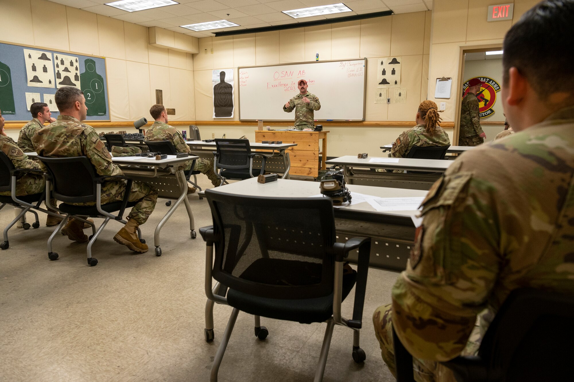 U.S. Air Force Staff Sgt. Gabriel Baumgartner, 51st Security Forces Squadron combat arms instructor, briefs airmen before they compete in the 2023 Police Week Excellence in Competition (EIC) on Osan Air Base, Republic of Korea, May 18, 2023. The EIC is an awards program recognizing marksmanship, open to any Air Force active duty, Air Force reserve or Air Force National Guard members. Individuals competed to earn a badge in  marksmanship through the  Civilian Marksmanship Program or the National Rifle Association. (U.S. Air Force photo by Airman 1st Class Aaron Edwards)