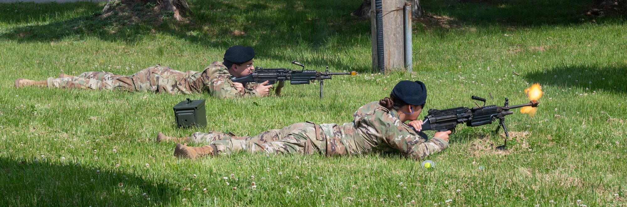U.S. Air Force Sean Gardner and U.S. Air Force Airman 1st Class Ha’ani Maratita, 51st Security Forces Squadron Defenders, fire blanks from M249 squad automatic weapons during the 2023 Police Week closing ceremony, May 19, 2023. During the ceremony, an honorary gun salute was performed to commemorate Defenders who've made the ultimate sacrifice. (U.S. Air Force photo by Airman 1st Class Aaron Edwards)
