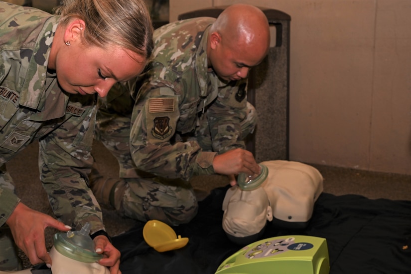 Pennsylvania Air National Guard Staff Sgt. Brianna VandeBunte, left, who is assigned to the Pennsylvania Air National Guard’s 111th Force Support Squadron, headquartered at Biddle Air National Guard base in Horsham, Pennsylvania, and Airman 1st Class Roann Gatdula, a public affairs specialist assigned to 154th Wing, at Hickam Air Force Base, Joint Base Pearl Harbor–Hickam, Honolulu, Hawaii, both practice administering CPR to training mannequins at JBPHH, June13, 2023. VandeBunte and Gatdoula both went through CPR training while members of the 111th ATKE were in Hawaii for a two-week training exercise known as Koa Lani. (U.S. Air national Guard phot by Staff Sgt. Wilfredo Acosta)