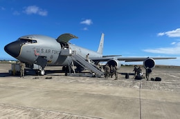 Members of the 111th Attack Wing, Headquartered at Biddle Air National Guard Base in Horsham Pennsylvania, unload their gear from a KC-135 Stratotanker that was after landing in Hawaii for a two-week training exercise known as Koa Lani that began on June 9, 2023. The 171st Air Refueling Wing and the 193rd Special Operations Wing joined forces to airlift 39 members of the 111th ATKW with the 171st providing a KC-aircraft and aircrew, and the 193rd Special Operations Wing providing the airfield and personnel required to load the aircraft, which took off for Hawaii from Harrisburg, Pennsylvania. (U.S. Air National Guard courtesy photo by Capt. Paul Perreault)