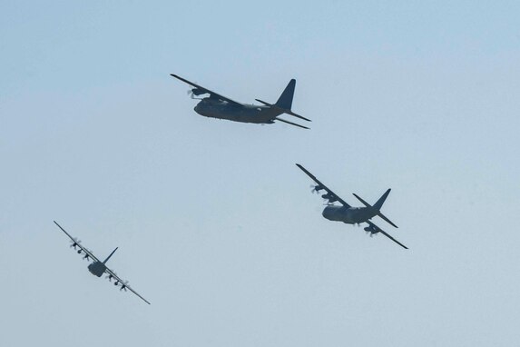 Three Royal Air Force C-130 Hercules aircraft fly over RAF Mildenhall to mark the aircraft’s retirement at RAF Mildenhall Mildenhall, England, June 14, 2023. The RAF conducted a national fly over tour of three C-130’s and reached numerous military installations across England, Wales, Scotland and Northern Ireland throughout the day. (U.S. Air Force photo by Staff Sgt. Jesenia Landaverde)