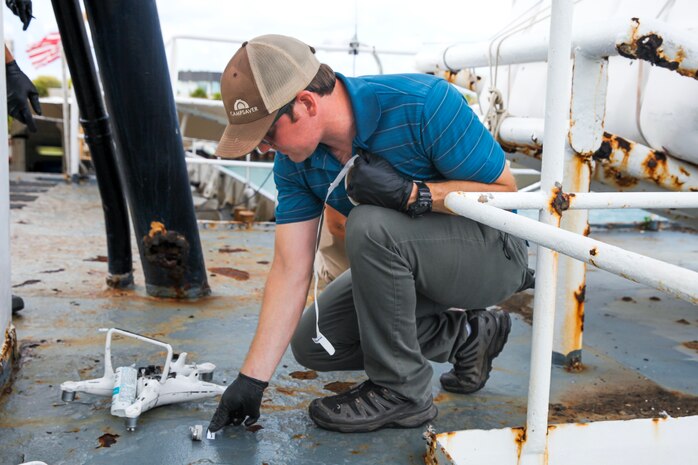 An Expeditionary Exploitation Unit One Technical Exploitation Platoon member collects evidence during a site exploitation training scenario as part of the maritime post-blast investigation course at Naval Air Station Key West, June 2-9. The course was developed to expand and develop EOD operator’s skillset in maritime post-blast exploitation techniques through classroom coursework, diving and strategic case study analysis. (U.S. Navy photo by Holly Dodds)